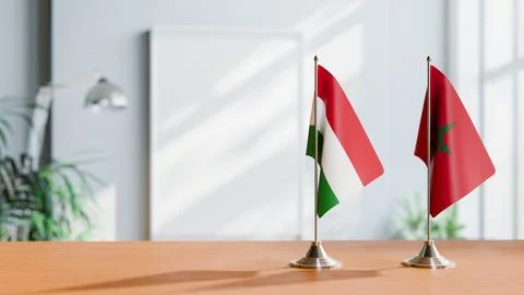 FLAGS OF HUNGARY And MOROCCO ON TABLE Stock Photos