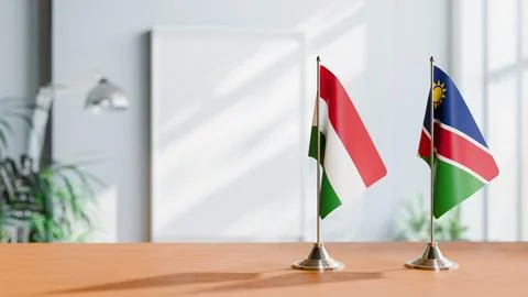 FLAGS OF HUNGARY And NAMIBIA ON TABLE Stock Photos