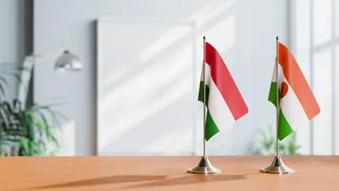 FLAGS OF HUNGARY And NIGER ON TABLE Stock Photos
