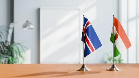 FLAGS OF ICELAND And NIGER ON TABLE Stock Photos