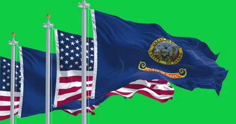 Flags of Idaho and US waving in the wind isolated on green background Stock Footage 337105961