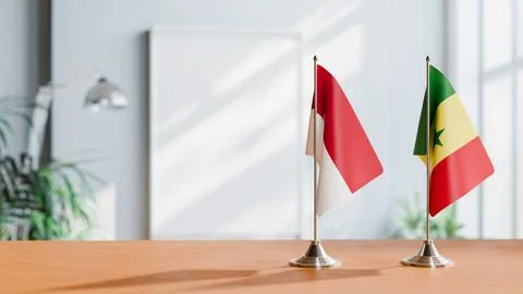 FLAGS OF INDONESIA And SENEGAL ON TABLE Stock Photos