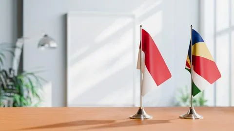 FLAGS OF INDONESIA And SEYCHELLES ON TABLE Stock Photos