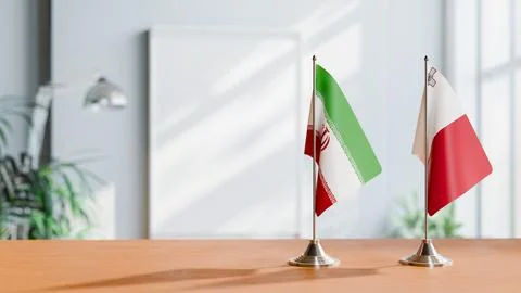 FLAGS OF IRAN AND MALTA ON TABLE Stock Photos