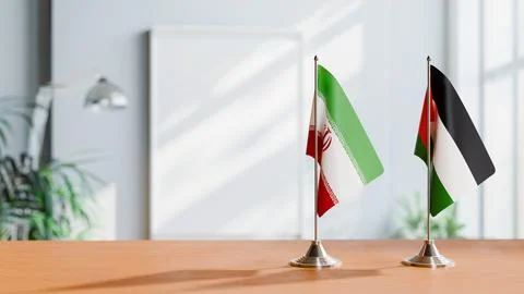 FLAGS OF IRAN AND PALESTINE ON TABLE Stock Photos
