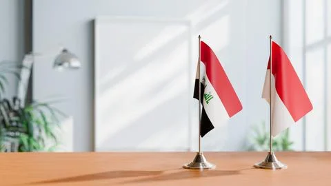 FLAGS OF IRAQ AND MONACO ON TABLE Stock Photos