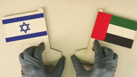 Flags of Israel and the UAE made of recycled paper on the cardboard table, top Stock Footage 141992158