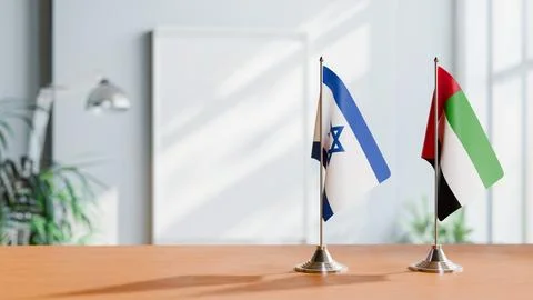 FLAGS OF ISRAEL AND UAE ON TABLE Stock Photos