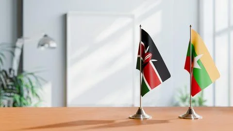 FLAGS OF KENYA AND MYANMAR ON TABLE Stock Photos