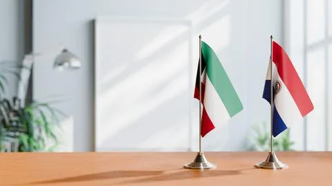 FLAGS OF KUWAIT AND PARAGUAY ON TABLE Stock Photos