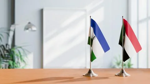 FLAGS OF LESOTHO AND SUDAN ON TABLE Stock Photos