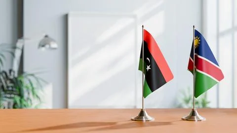 FLAGS OF LIBYA AND NAMIBIA ON TABLE Stock Photos