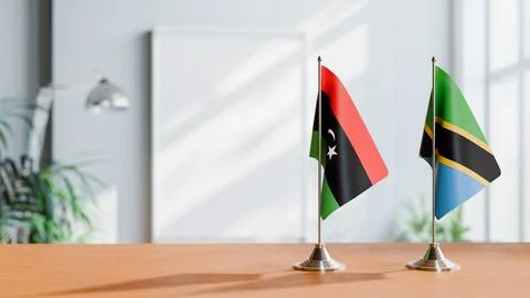 FLAGS OF LIBYA AND TANZANIA ON TABLE Stock Photos