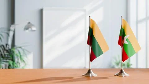 FLAGS OF LITHUANIA AND MYANMAR ON TABLE Stock Photos
