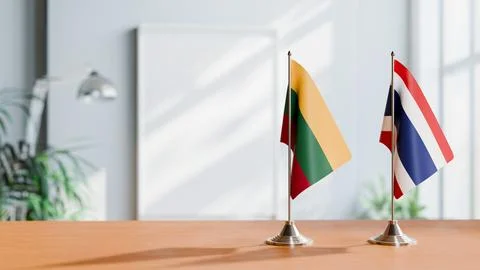 FLAGS OF LITHUANIA AND THAILAND ON TABLE Stock Photos