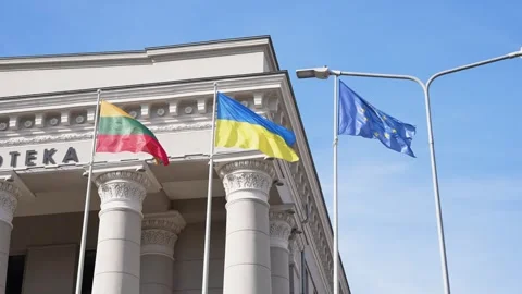 Flags of Lithuania, Ukraine, and EU Waving at Martynas Mažvydas National Stock Footage 343852011
