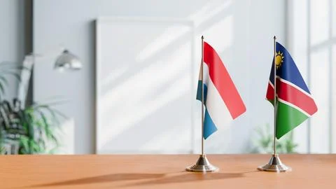 FLAGS OF LUXEMBOURG AND NAMIBIA ON TABLE Stock Photos
