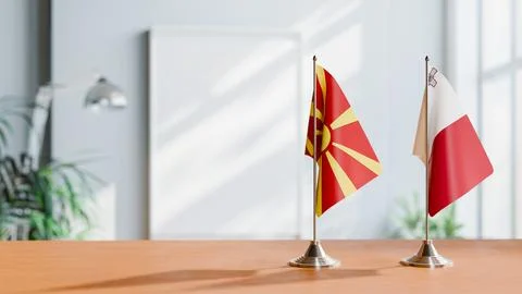 FLAGS OF MACEDONIA AND MALTA ON TABLE Stock Photos