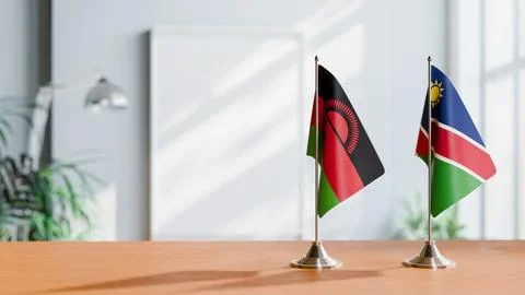 FLAGS OF MALAWI AND NAMIBIA ON TABLE Stock Photos