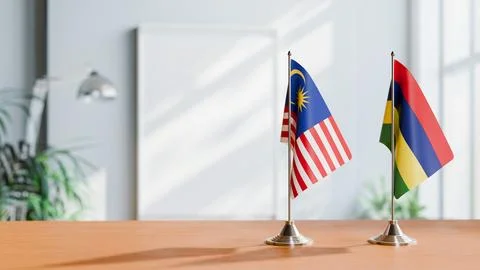 FLAGS OF MALAYSIA AND MAURITIUS ON TABLE Stock Photos