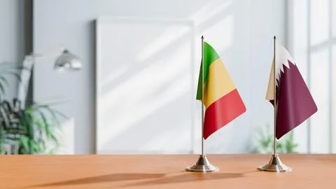 FLAGS OF MALI AND QATAR ON TABLE Stock Photos