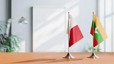 FLAGS OF MALTA AND MYANMAR ON TABLE Stock Photos