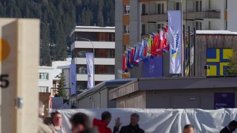 Flags of many nations outside a venue during the World Economic Forum Annual Stock Footage 345299497