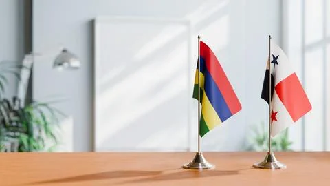 FLAGS OF MAURITIUS AND PANAMA ON TABLE Stock Photos