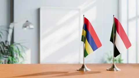 FLAGS OF MAURITIUS AND SUDAN ON TABLE Stock Photos