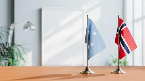 FLAGS OF MICRONESIA AND NORWAY ON TABLE Stock Photos