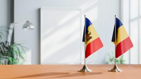 FLAGS OF MOLDOVA AND ROMANIA ON TABLE Stock Photos