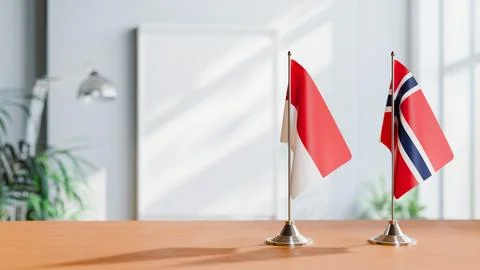 FLAGS OF MONACO AND NORWAY ON TABLE Stock Photos