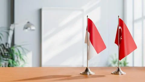 FLAGS OF MONACO AND TURKEY ON TABLE Stock Photos