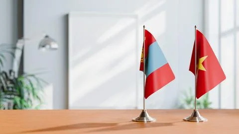 FLAGS OF MONGOLIA AND VIETNAM ON TABLE Stock Photos