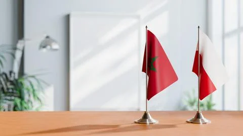 FLAGS OF MOROCCO AND POLAND ON TABLE Stock Photos