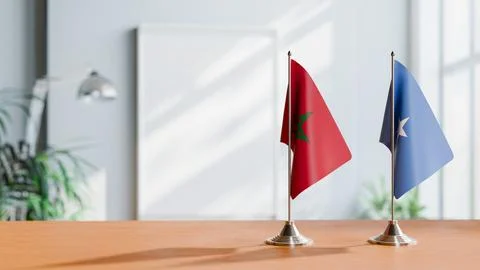 FLAGS OF MOROCCO AND SOMALIA ON TABLE Stock Photos
