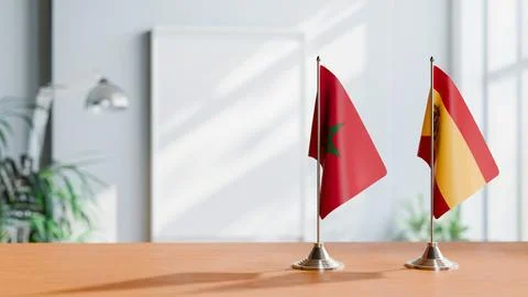 FLAGS OF MOROCCO AND SPAIN ON TABLE Stock Photos