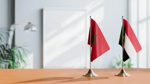 FLAGS OF MOROCCO AND SUDAN ON TABLE Stock Photos