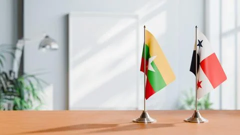 FLAGS OF MYANMAR AND PANAMA ON TABLE Stock Photos