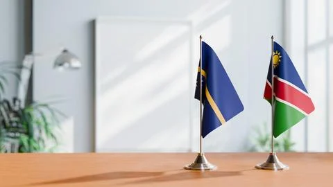 FLAGS OF NAMIBIA AND NAURU ON TABLE Stock Photos