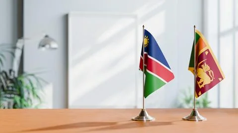 FLAGS OF NAMIBIA AND SRI LANKA ON TABLE Stock Photos