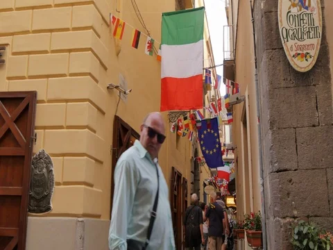 Flags on narrow street, Sorrento, Costiera Amalfitana (Amalfi Coast), UNESCO Stock Footage