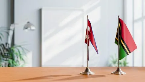 FLAGS OF NEPAL AND VANUATU ON TABLE Stock Photos