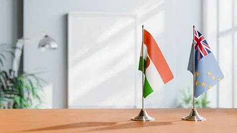 FLAGS OF NIGER AND TUVALU ON TABLE Stock Photos