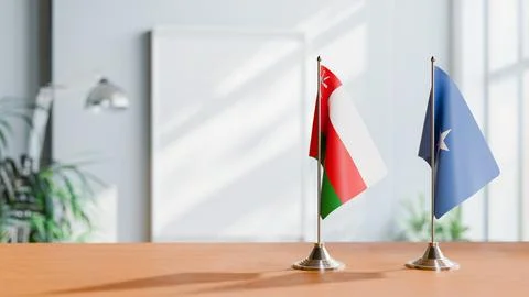 FLAGS OF OMAN AND SOMALIA ON TABLE Stock Photos