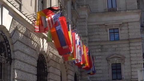 Flags of the OSCE participating States on the headquarters building in Vienna Stock Footage 101099372