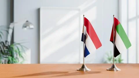 FLAGS OF PARAGUAY AND UAE ON TABLE Stock Photos