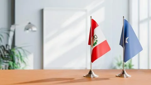 FLAGS OF PERU AND SOMALIA ON TABLE Stock Photos