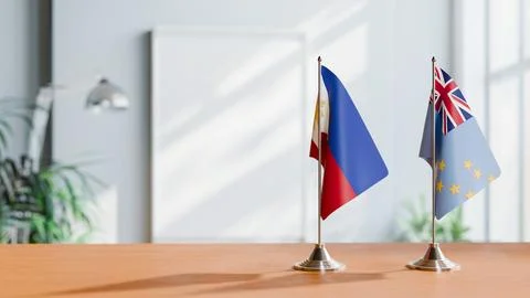 FLAGS OF PHILIPPINES AND TUVALU ON TABLE Stock Photos