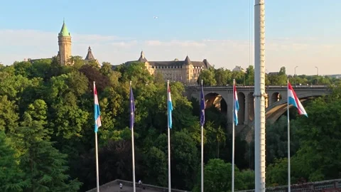 Flags in the Place de la Constitution in Luxembourg Vídeos de archivo 341786864